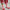 Kids corn dog striped socks with vertical red and white knit stripes, green ankle cuff, and corn dog graphic with Brrr logo-shaped ketchup detail, styled with rose corduroy pants