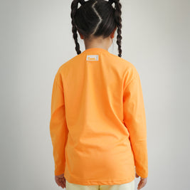 Back view of kids orange cotton long sleeve t-shirt featuring Brrr main label on the outside back neck